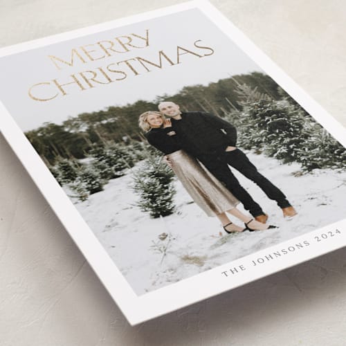 This is a cloud foil pressed holiday cards with foil pressed by Nicole Walsh called merry & classic printing on recycled smooth signature in standard