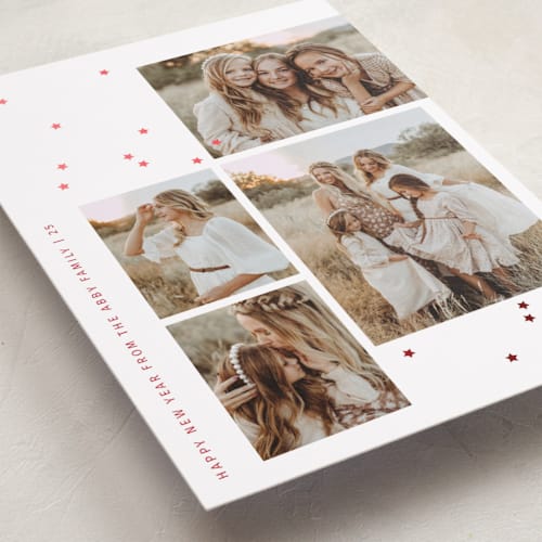This is a poinsettia foil pressed holiday cards with foil pressed by Sumak Studio called tiny stars confetti printing on recycled smooth signature in standard