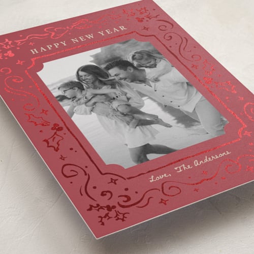 This is a crimson foil pressed holiday cards with foil pressed by Cass Loh called holly whirl printing on recycled smooth signature in standard