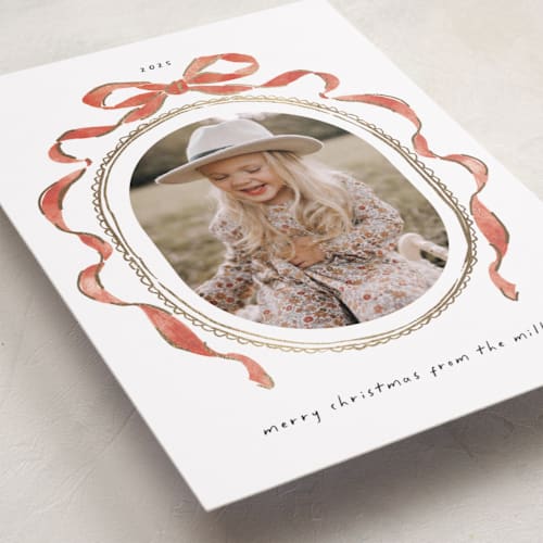 This is a pomegranate foil pressed holiday cards with foil pressed by Susan Zinader called whimsical bow printing on recycled smooth signature in standard
