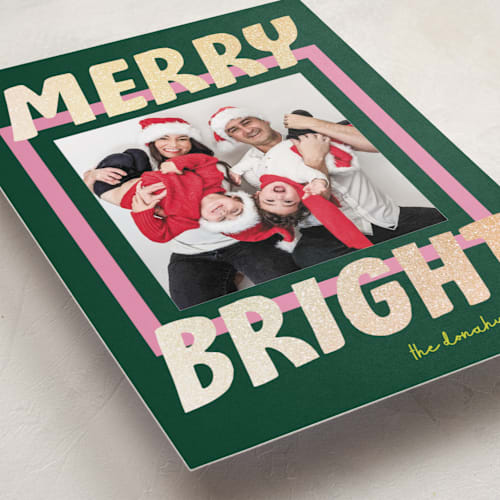 This is a evergreen foil pressed holiday cards with foil pressed by Shari Margolin called bold and bright printing on recycled smooth signature in standard