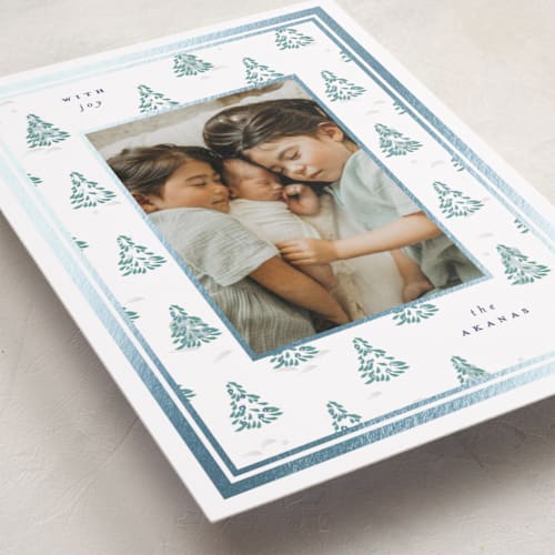 This is a blue spruce foil pressed holiday cards with foil pressed by Corinne Malesic called little trees printing on recycled smooth signature in standard