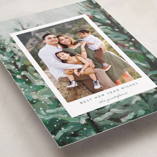 This is a pine foil pressed holiday cards with foil pressed by Holly Whitcomb called cozy snowy forest printing on recycled smooth signature in standard