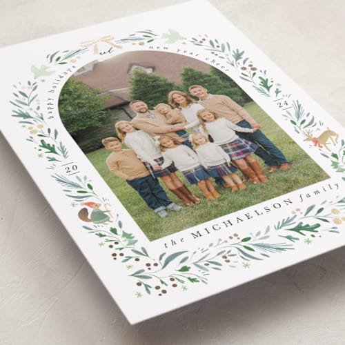 This is a cypress foil pressed holiday cards with foil pressed by Hannah Williams called woodland arch printing on recycled smooth signature in standard