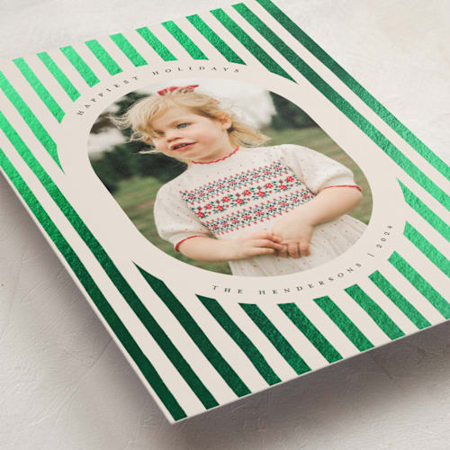 This is a evergreen foil pressed holiday cards with foil pressed by Teju Reval called vintage stripes printing on recycled smooth signature in standard