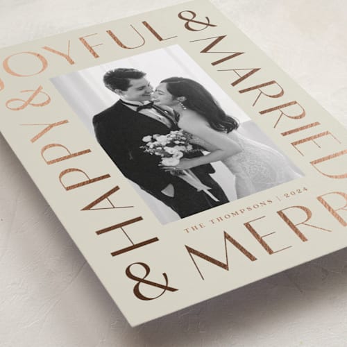 This is a eggnog foil pressed holiday cards with foil pressed by Louise Kay called joyfully married printing on recycled smooth signature in standard