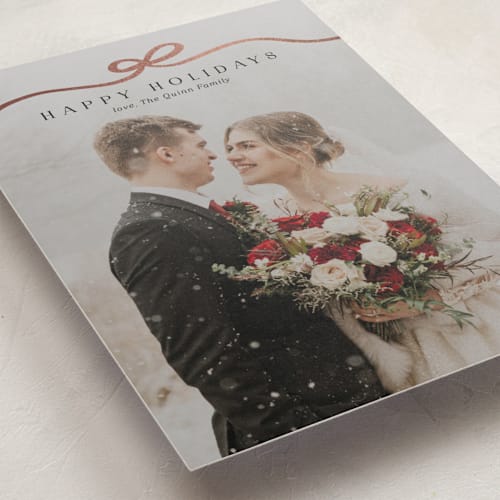 This is a coal foil pressed holiday cards with foil pressed by Kaydi Bishop called bow tied printing on recycled smooth signature in standard