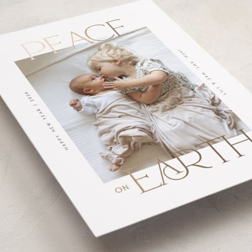 This is a snow foil pressed holiday cards with foil pressed by Owl and Toad called peace on earth sparkle printing on recycled smooth signature in standard