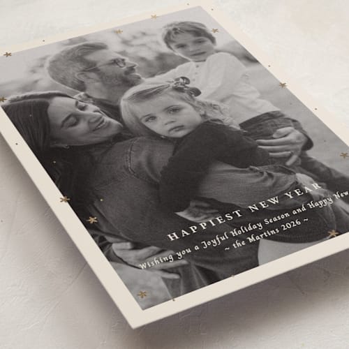 This is a champagne foil pressed holiday cards with foil pressed by Ani Somi called merry little stars printing on recycled smooth signature in standard