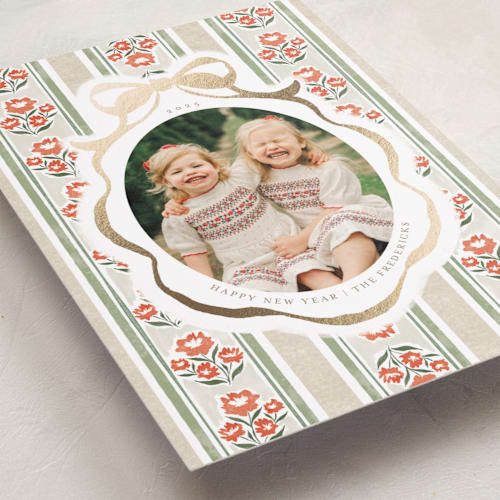 This is a latte foil pressed holiday cards with foil pressed by Jackie Crawford called wildflower holiday ribbon printing on recycled smooth signature in standard