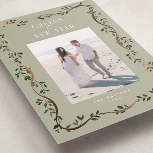 This is a sage foil pressed holiday cards with foil pressed by Everett Paper Goods called adorn framed printing on recycled smooth signature in standard