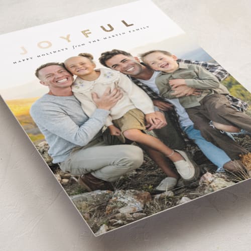 This is a coal foil pressed holiday cards with foil pressed by Laura Hamm called a joyful family printing on recycled smooth signature in standard
