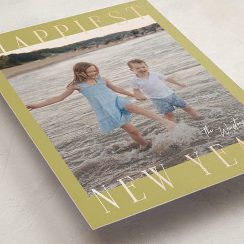This is a spearmint foil pressed holiday cards with foil pressed by Ekko Studio called headlines printing on recycled smooth signature in standard