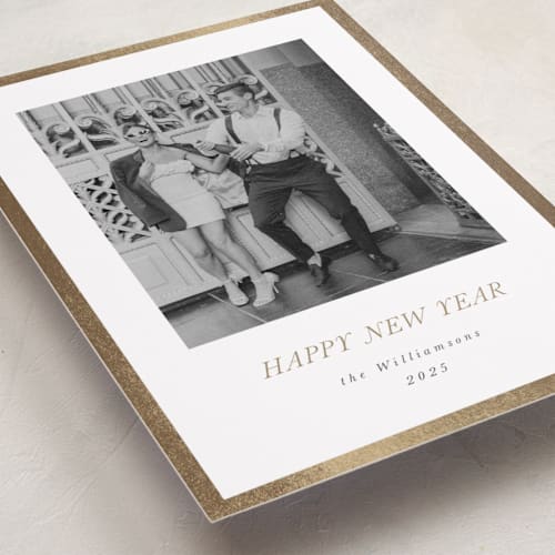 This is a champagne foil pressed holiday cards with foil pressed by Jenna Holcomb called bordered printing on recycled smooth signature in standard