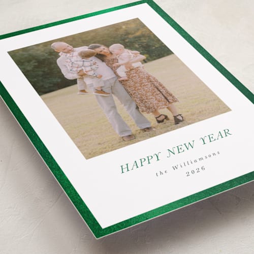 This is a evergreen foil pressed holiday cards with foil pressed by Jenna Holcomb called bordered printing on recycled smooth signature in standard