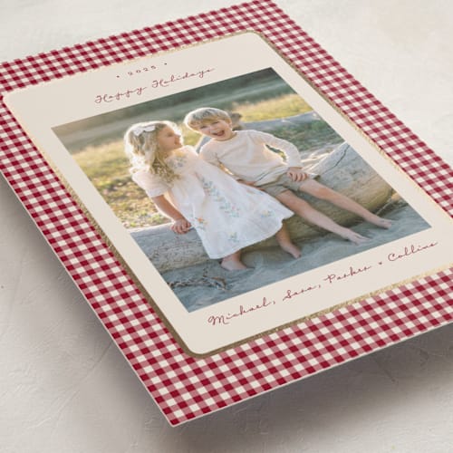 This is a cranberry foil pressed holiday cards with foil pressed by Emily Betts called gingham vintage printing on recycled smooth signature in standard