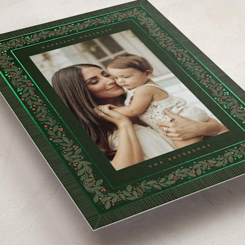 This is a fir foil pressed holiday cards with foil pressed by Jenna Holcomb called antique greenery printing on recycled smooth signature in standard