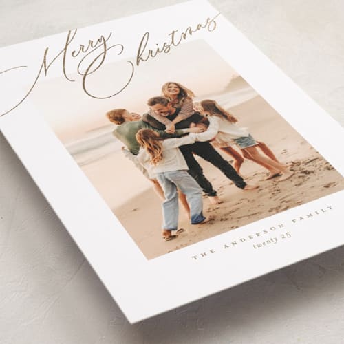 This is a golden foil pressed holiday cards with foil pressed by Jessica Williams called topper printing on recycled smooth signature in standard