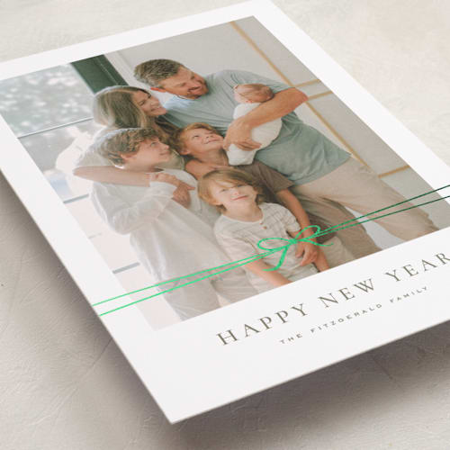 This is a cedar foil pressed holiday cards with foil pressed by Wildfield Paper Co called delicate ribbon printing on recycled smooth signature in standard