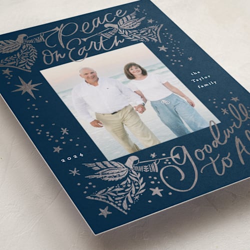 This is a navy foil pressed holiday cards with foil pressed by Alethea and Ruth called peace on earth angels printing on recycled smooth signature in standard