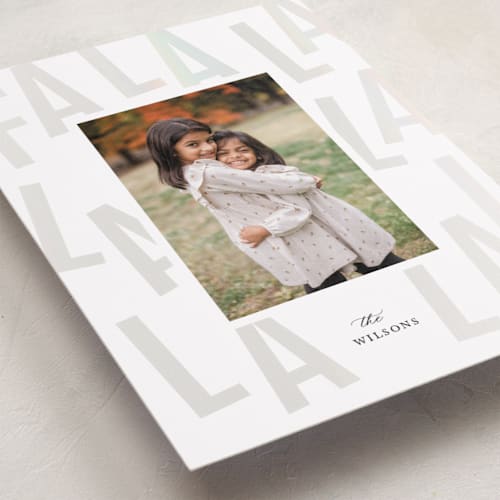 This is a snow gloss press holiday cards with gloss press by Laura Bercovich called bold fa la la printing on recycled smooth signature in standard