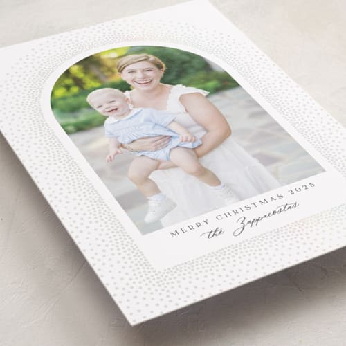 This is a snow gloss press holiday cards with gloss press by Kamala Nahas called frosted arch printing on recycled smooth signature in standard