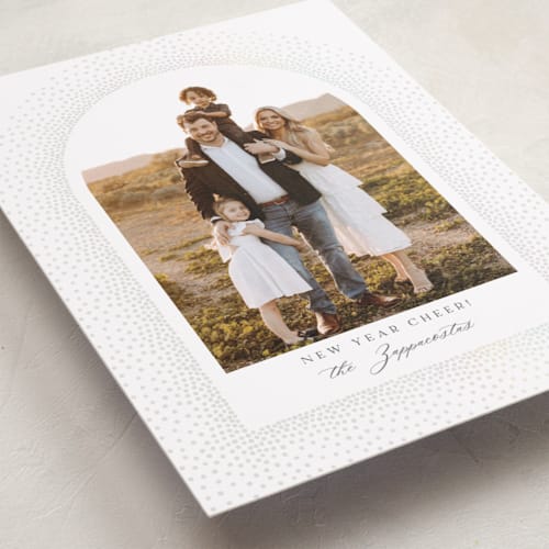 This is a snow gloss press holiday cards with gloss press by Kamala Nahas called frosted arch printing on recycled smooth signature in standard