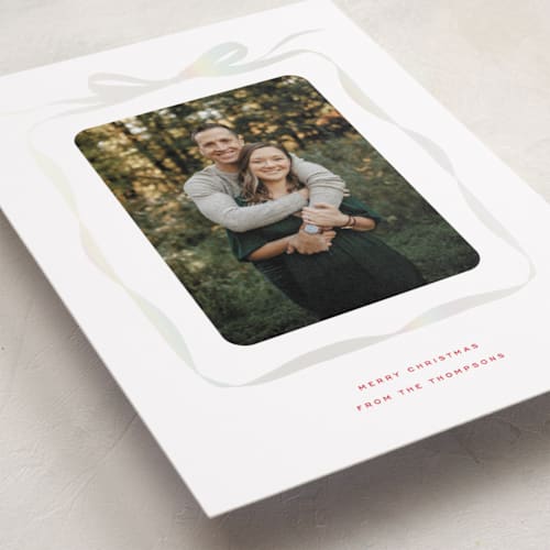 This is a crimson gloss press holiday cards with gloss press by Olivia Kanaley Inman called bow printing on recycled smooth signature in standard
