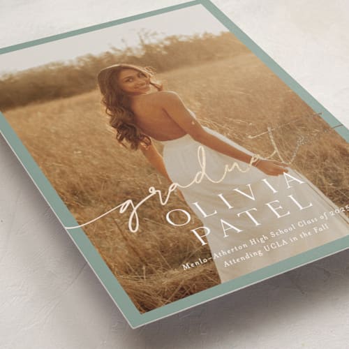 This is a sage graduation announcements with foil pressed by Sarah Curry called graduate script printing on recycled smooth signature in standard