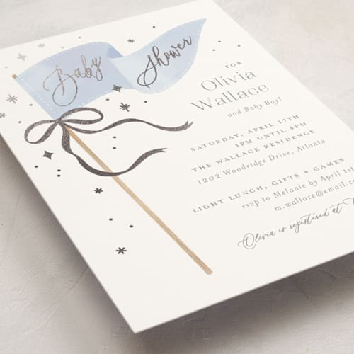 This is a baby blue foil stamped baby shower invitations with foil pressed by Paper Raven Co. called bows & banners printing on signature in standard