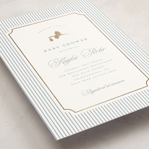 This is a dusty blue foil stamped baby shower invitations with foil pressed by Stacey Meacham called storybook stork printing on signature in standard