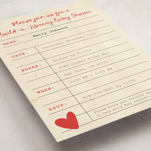 This is a coral baby shower invitations with standard by Ilene Guy called build a library printing on signature in standard