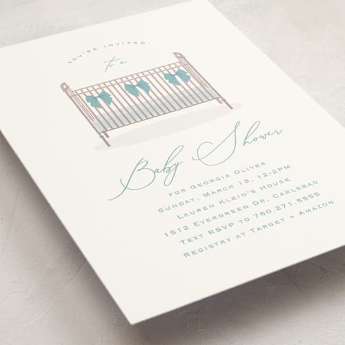 This is a powder blue baby shower invitations with standard by Carolyn MacLaren called crib bows printing on signature in standard