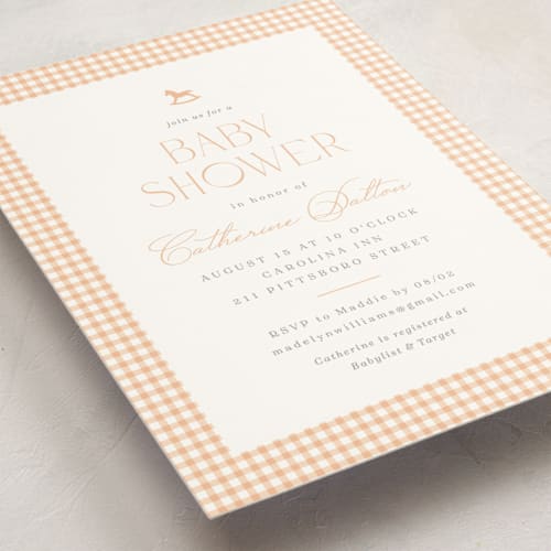 This is a peach baby shower invitations with standard by Olivia Raufman called gingham rockinghorse printing on signature in standard