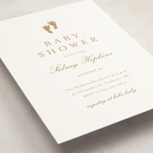 This is a golden baby shower invitations with standard by Stacey Meacham called footprint printing on signature in standard
