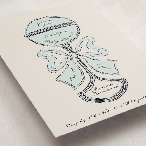 This is a powder baby shower invitations with standard by Gwen Bedat called antique rattle printing on signature in standard