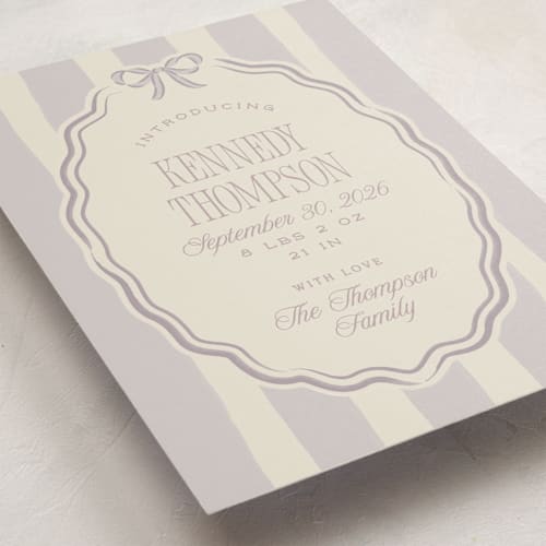 This is a lilac birth announcements with standard by Robert and Stella called bow frame printing on signature in standard