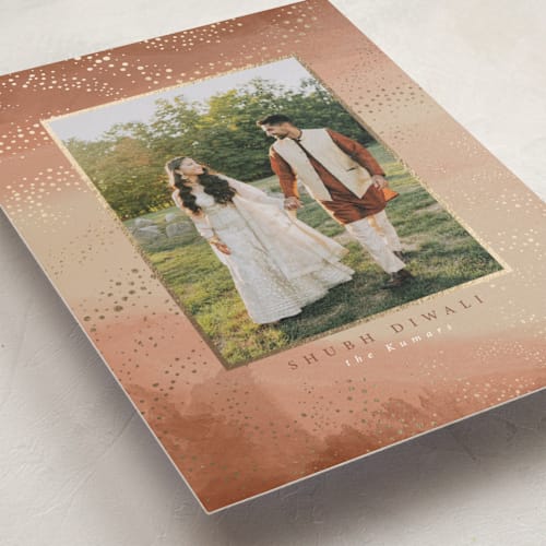 This is a almond diwali cards with foil pressed by Tamara Hilje called diya trails printing on signature in standard