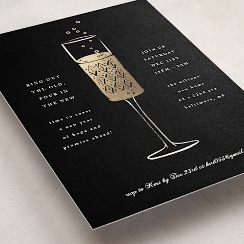 This is a midnight holiday party invitations with foil pressed by mo kelley called champagne flute printing on signature in standard