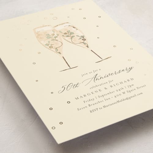 This is a ivory holiday party invitations with foil pressed by Kamala Nahas called champagne toast printing on signature in standard