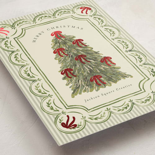 This is a evergreen business holiday cards with foil pressed by Chris Griffith called holiday bow tree printing on signature in standard