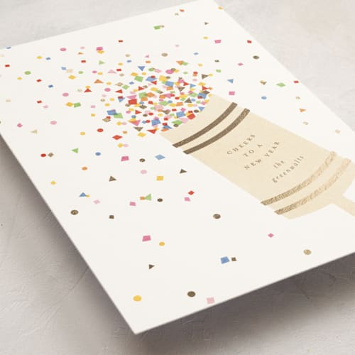 This is a snow foil pressed holiday cards with foil pressed by Ellen Schlegelmilch called confetti popper printing on signature in standard
