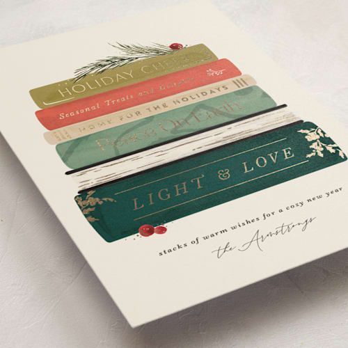 This is a holly jolly foil pressed holiday cards with foil pressed by Kate Ahn called book stack printing on signature in standard