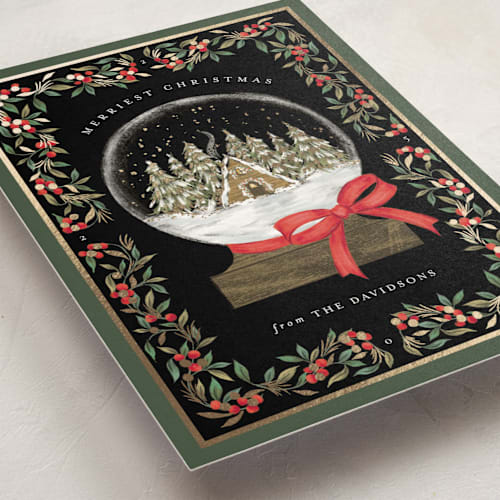 This is a coal foil pressed holiday cards with foil pressed by Jackie Crawford called cabin snow globe printing on signature in standard
