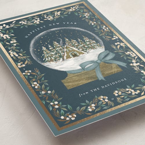 This is a frost foil pressed holiday cards with foil pressed by Jackie Crawford called cabin snow globe printing on signature in standard