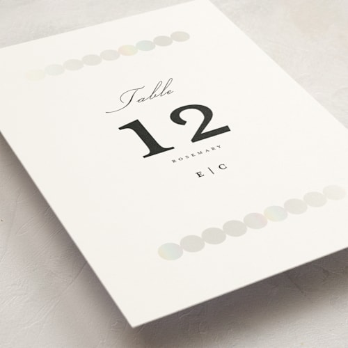 This is a silk table numbers with foil pressed by mo kelley called pearls printing on doublethick in standard