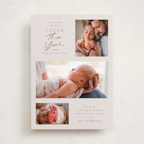 This is a toffee babys first christmas with standard by Everett Paper Goods called merrier this year printing on recycled smooth signature in standard
