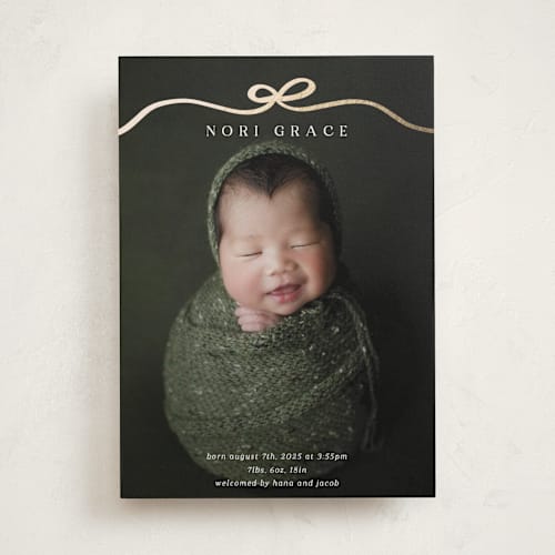 This is a cotton foil stamped birth announcements with foil pressed by Kaydi Bishop called bow tied printing on smooth signature in standard
