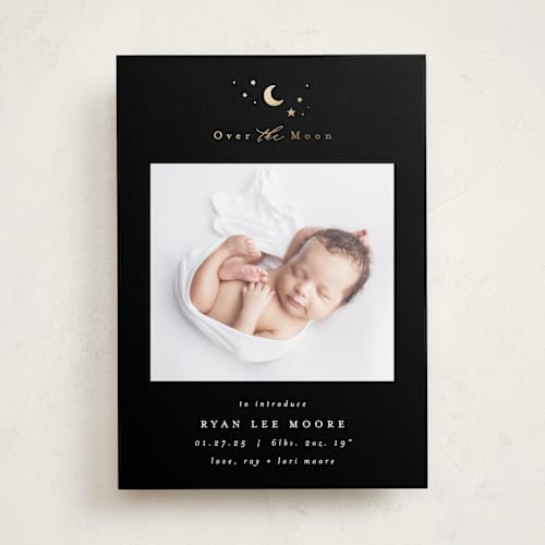 This is a noir foil stamped birth announcements with foil pressed by AK Graphics called over the moon printing on smooth signature in standard