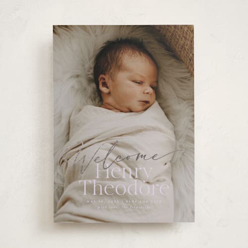 This is a lilac foil stamped birth announcements with foil pressed by Jackie Crawford called scripted welcome printing on smooth signature in standard